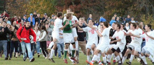 acma Derek Grammer (green shirt) mobbed after Justin Clark pk winner