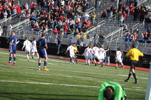 F - Masco players rush to fans as MHS goalie Bryan Peguero is down in foreground