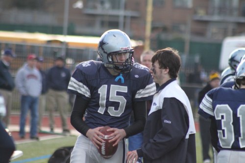 B1 Steve Brao (15) gets pointers from Trevor Lyons