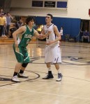 lyst A2 Ryan Hayward (0) defends Owen Marchetti (23)