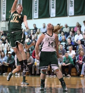 Elise Makowski soars in the lane over Coley Viselli during a strong Hornet first half