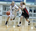 Taylor Herd (9 points) tries to get past Alyssa Christiansen