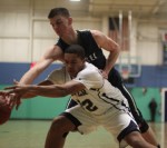 Jordan Scurry and Connor Reardon reach for a loose ball