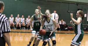 Tess Nogueira (12 points) looks to go under and up