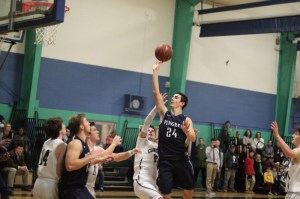 Justin Assad (13 points) floats in the lane