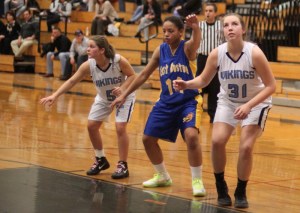 Harley Wood (8 points) readies to rebound