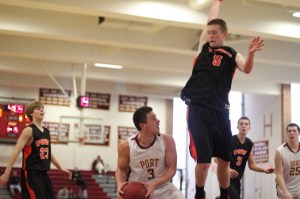 Colton Fontaine (14 points) looks for an opening against Ipswich shot-blocker Erik Fyrer (11 points)