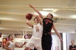 Erik Fyrer goes for the block against Ian Michaels