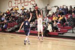 Colby Morris (10 points) shoots over Traverse Briana
