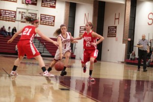 Aly Leahy tries to split two Chieftain defenders