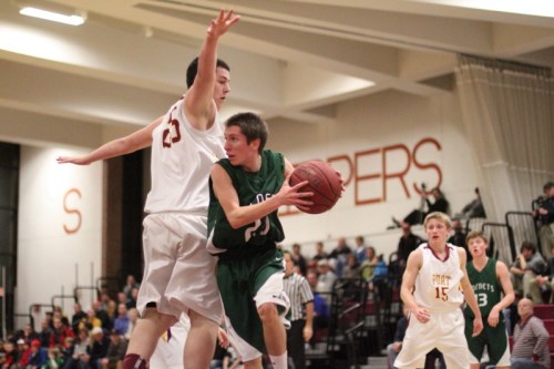 Liam Aldrich (10 points) looks for someone to pass to
