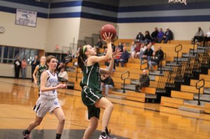 Ivy Silag Stearns takes a long pass from Sydney Christopher in for a layup