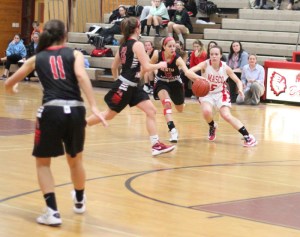 Pam Coufos (10) steals from Meghan Collins (5) late in the game