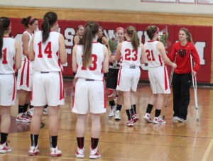 Morgan Lumb (on crutches) gives Abi Rose flowers