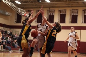 Kayla Riley tries to split the Greater Lowell defense