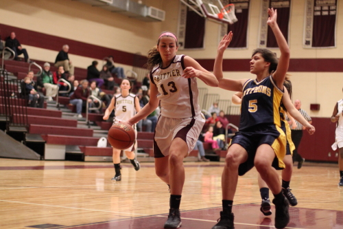 Michaela Martin (24 points) gets in close as Catherine Sweeney tries to avoid fouling