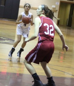 Katie Benzan (16 points) lines up a three
