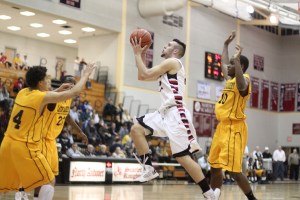Derek Collins (10 points) floats to the rim