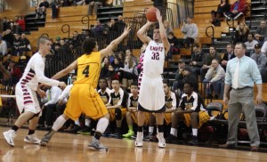 Brendan Miller (10 points) shoots from the corner as BLA coach Dan Bunker watches