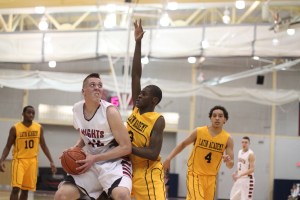 Isaiah Nelson in close guarded by Fritz Jolivain