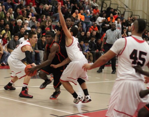 Malik James (25 points) tries to get between two Salem defenders