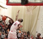 David Kazadi tries to block the shot of Nick Simpson