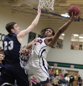 MVP Ron Patterson (11 points) defended by Dylan Haines