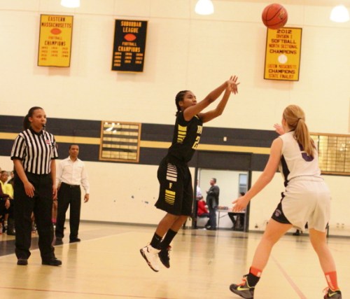 Tajaynay Veiga (24 points) fires a three over Emily Irwin