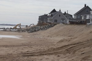 Longer view to the area where the cranes are being used.