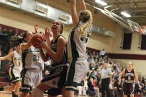 Sam Hyslip (21 points) looks for a shot inside