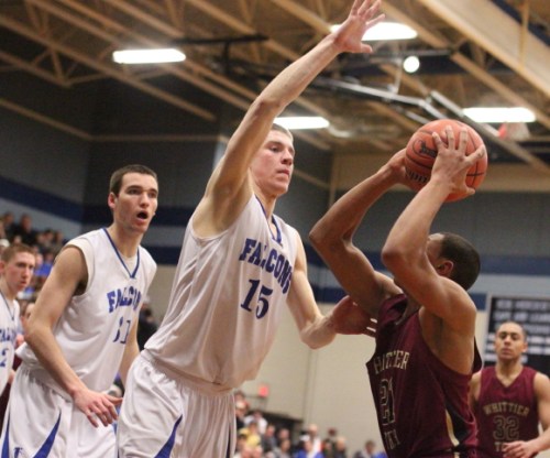 Nick Bates (19 points) goes for the block against Justin Reyes (22 points)