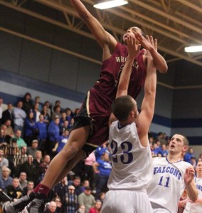Justin Reyes soars for two over Nick McKenna