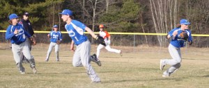 Shortstop Colby Ingraham prepares to throw home to get a key out in the fifth inning