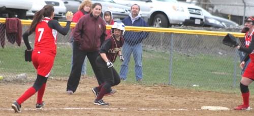 Lauren Singer, caught in a rundown, escaped and later scored as Coach Lori Solazzo looks on.