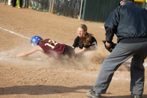 Lauren Singer is tagged out at home by pitcher Tyler Feeney.