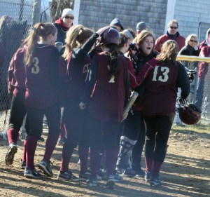 Casey Barlow (#13) gets congratulated after her two-run blast