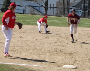 Shortstop John Prentice (back on his heels) had trouble with two grounders