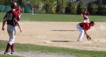 Zack Fitzgerald fields a grounder as Ian Michaels races to third