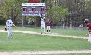 Max Nesbit catches a popup as Ryan Short starts back to third