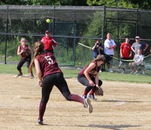 Third baseman Meghan Stanton throws a strike to first