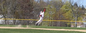 Shortstop Ben Cullen leaps for a high bouncer