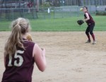 Kendra Dow throws to first