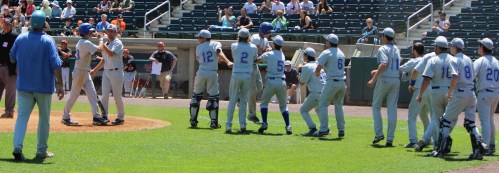 Hopedale celebrates their run in the 7th inning
