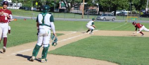 Ian Michaels dives into third with an RBI triple in the sixth inning