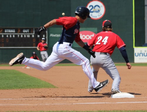 Peter Hissey hustles to beat the throw to first enabling the Portland Sea Dogs to score their first run.