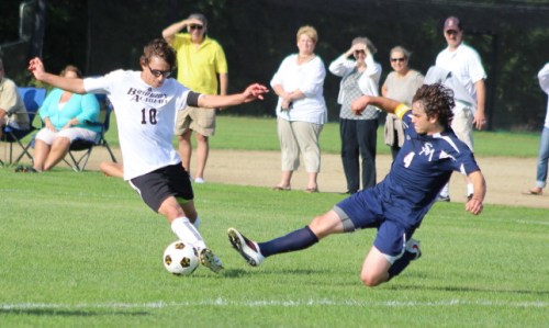 Connor Reagan (2 goals) eludes defender Zach Napsey in the first half