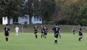 Gabe Smith (#8) after scoring a goal for Bowdoin late in the first half