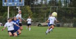 Lexi L Heureux-Carland clears away a Kennebunk threat