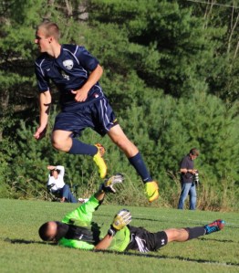 Mike Gallagher (2 goals) sails over LR goalie as he scores the 10th York goal