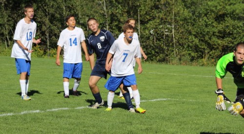 Josh Mitchell (8) watches the first of his four goals go past Lake Region goalie Mike Rust